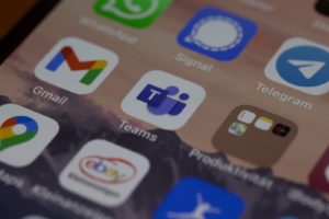 iphone screen with microsoft teams icons on screen